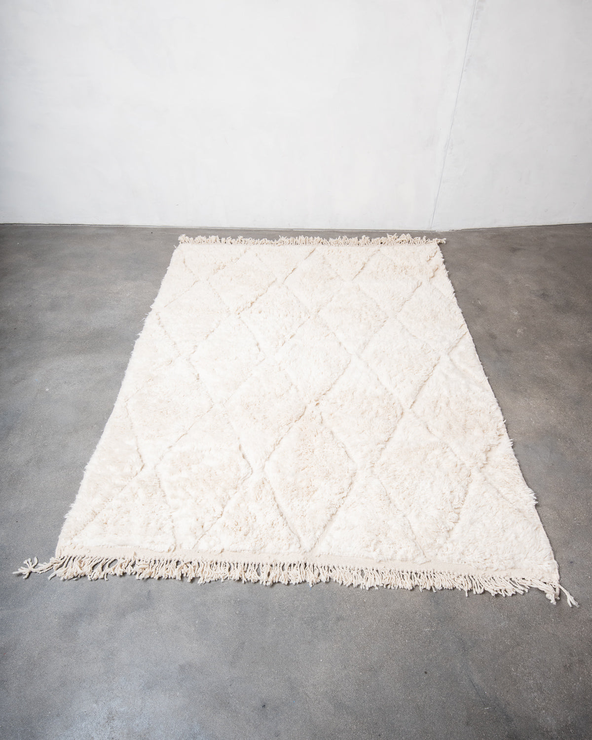 Modern, designer, handcrafted Berber rug from Morocco. Beniourain carpet with beautiful colours and patterns and fluffy wool texture.